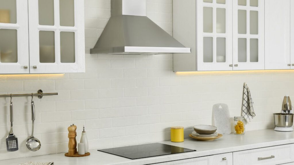 Elegant Kitchen Interior with Modern Range Hood over Cooktop.